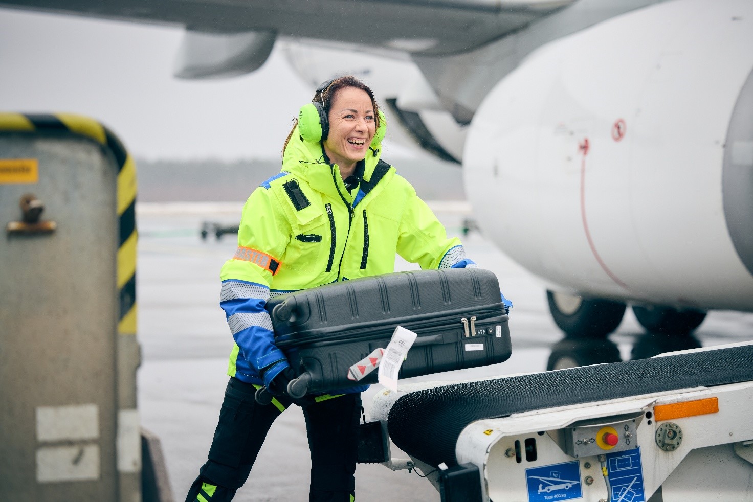 A person carrying a luggage AI-generated content may be incorrect., Picture